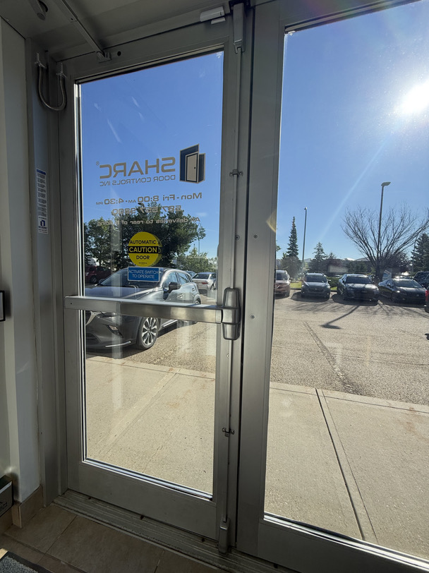 Von Duprin Vertical Rod Exit device with QEL on an Automatic Door integrated with access control